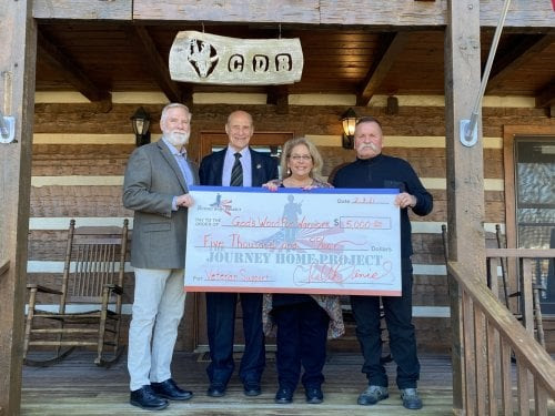 General Keith M. Huber with David Corlew, Angela give hold check for God's Word Warriors